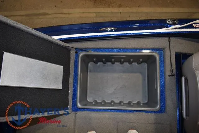Slide: The Image of 2019 Nitro Z19 boat storage compartment with open lid, featuring Thayer's Marine logo. - 28