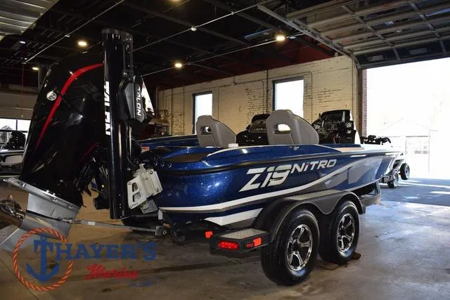 Slide: The Image of 2019 Nitro Z19 boat in showroom, featuring sleek design and dual seats. - 3