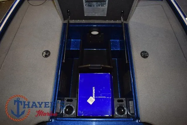 Slide: The Image of 2019 Nitro Z19 boat storage compartment with carpeted interior and blue accents. - 33