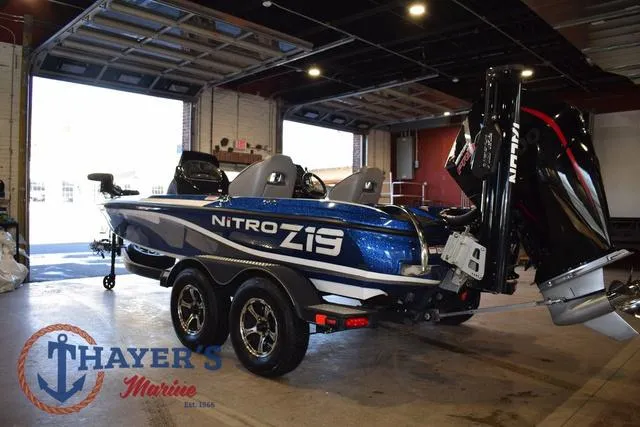 Slide: The Image of 2019 Nitro Z19 boat in showroom, featuring sleek design and powerful engine. - 5