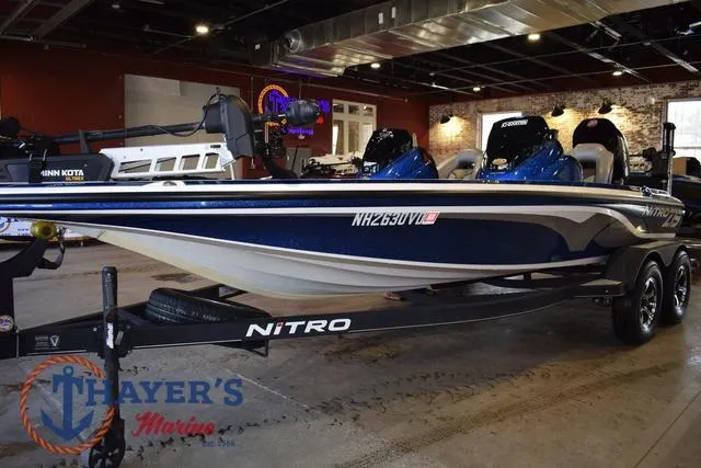 Slide: The Image of 2019 Nitro Z19 boat on display in showroom with trailer. - 7