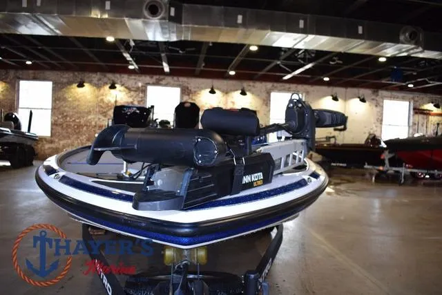 Slide: The Image of 2019 Nitro Z19 boat in showroom, featuring Minn Kota trolling motor. - 8