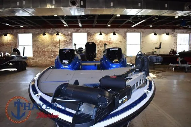 Slide: The Image of 2019 Nitro Z19 boat in showroom, featuring Minn Kota trolling motor. - 9