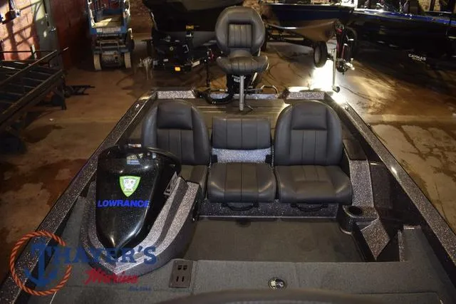 Slide: The Image of 2016 Stratos 176 VLO™ boat interior with black seating and Lowrance equipment. - 12