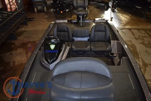 Slide: The Image of 2016 Stratos 176 VLO™ boat interior with seating and Lowrance equipment. - 13