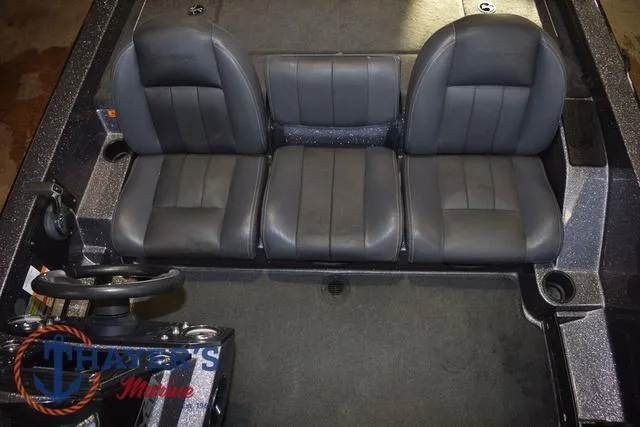 Slide: The Image of 2016 Stratos 176 VLO™ boat interior with three black seats and steering wheel. - 16