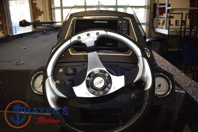 Slide: The Image of 2016 Stratos 176 VLO™ boat dashboard with steering wheel and Lowrance display. - 19