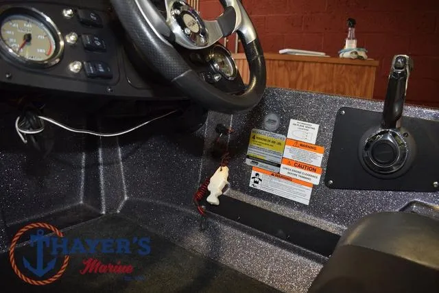 Slide: The Image of 2016 Stratos 176 VLO™ boat cockpit with steering wheel and control panel. - 20