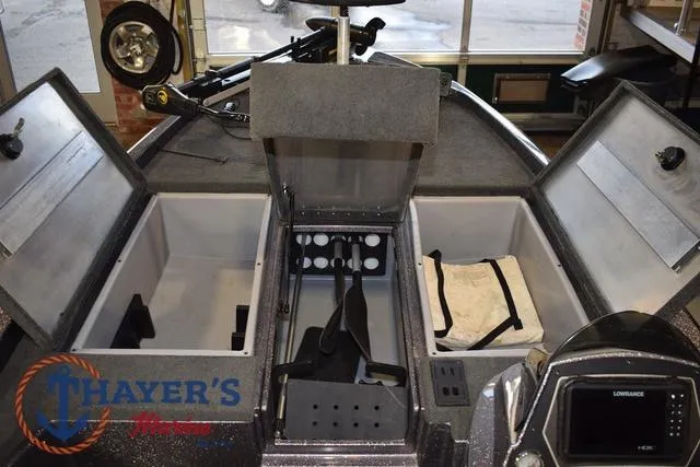 Slide: The Image of 2016 Stratos 176 VLO™ boat interior with storage compartments and control panel. - 24