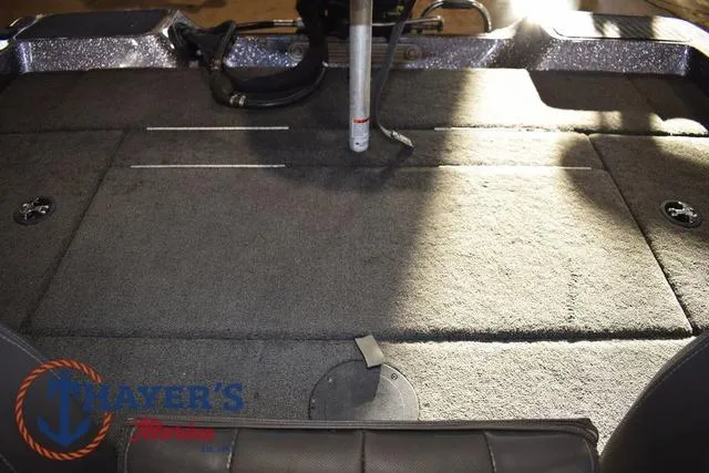 Slide: The Image of 2016 Stratos 176 VLO™ boat interior with carpeted deck and storage compartments. - 28