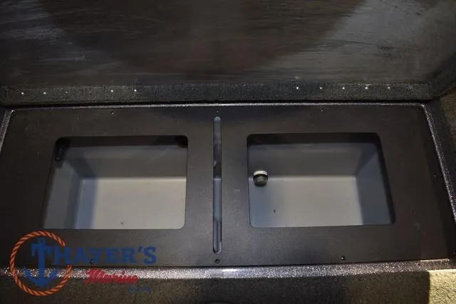 Slide: The Image of 2016 Stratos 176 VLO™ storage compartments, open and empty, with Thayer's Marine logo. - 30