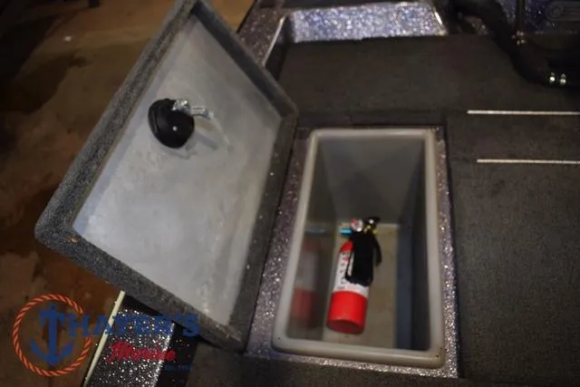 Slide: The Image of 2016 Stratos 176 VLO™ boat storage compartment with fire extinguisher. - 31