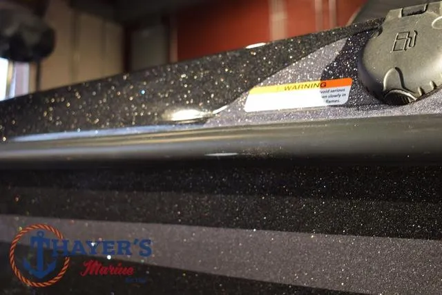 Slide: The Image of 2016 Stratos 176 VLO boat detail with warning label and Thayer's Marine logo. - 35