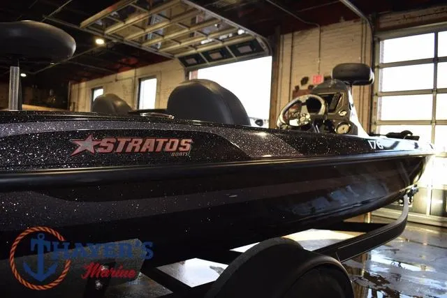 Slide: The Image of 2016 Stratos 176 VLO™ boat in showroom, side view with logo visible. - 5