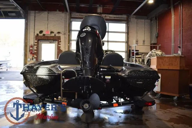 Slide: The Image of 2016 Stratos 176 VLO™ boat in a garage, rear view with motor and trailer. - 7