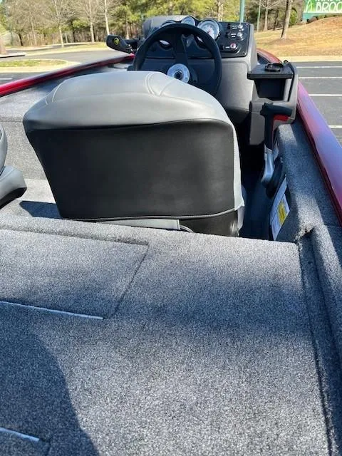 Slide: The Image of 2025 Tracker Pro 170 boat interior with gray seating and steering console. - 3