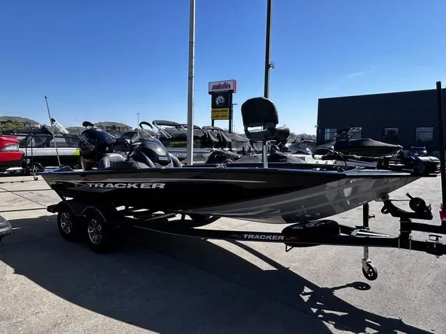Slide: The Image of 2023 Tracker Pro Team™ 195 TXW Tournament Edition boat on trailer, parked outdoors. - 10
