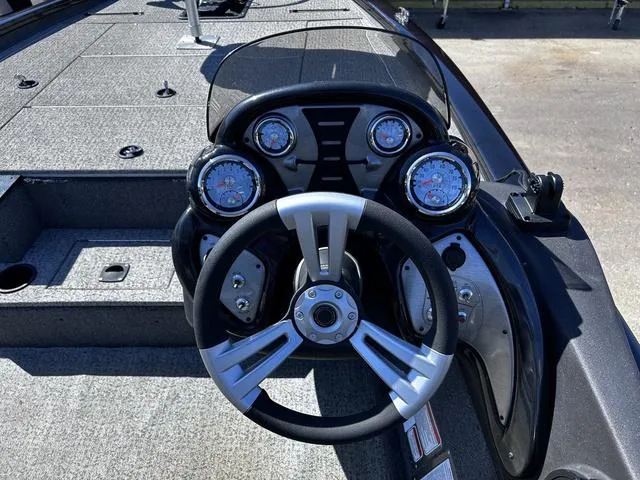 Slide: The Image of 2023 Tracker Pro Team™ 195 TXW Tournament Edition boat dashboard with steering wheel and gauges. - 7
