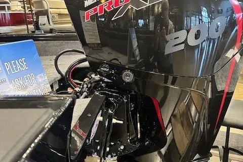 Slide: The Image of 2025 Tracker Targa V-18 WT with Mercury Pro XS 200 engine in showroom. - 2