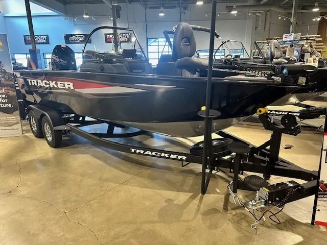 Slide: The Image of 2025 Tracker Targa V-18 WT boat displayed indoors on a trailer. - 3
