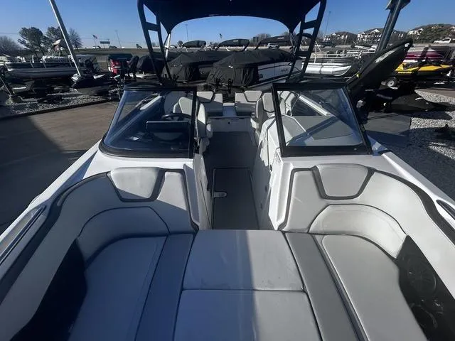 Slide: The Image of 2023 Yamaha Boats AR250 interior with sleek seating and modern design. - 14