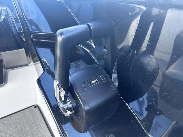 Slide: The Image of Throttle control of 2023 Yamaha Boats AR250, featuring sleek black design. - 21