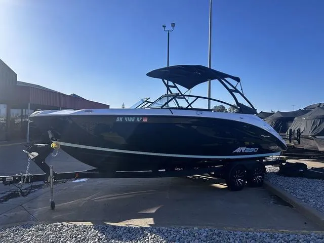 Slide: The Image of 2023 Yamaha Boats AR250 on trailer, sleek design, parked outdoors. - 7