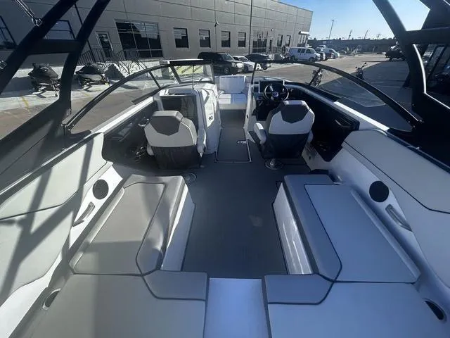 Slide: The Image of 2023 Yamaha Boats AR250 interior with modern seating and sleek design. - 9