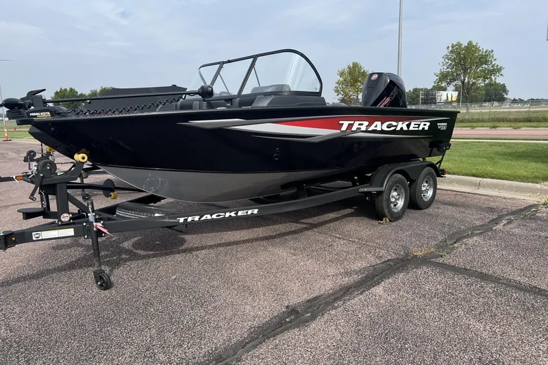 The Image of 2025 Tracker Targa V-18 Combo boat on trailer, parked outdoors. - 0