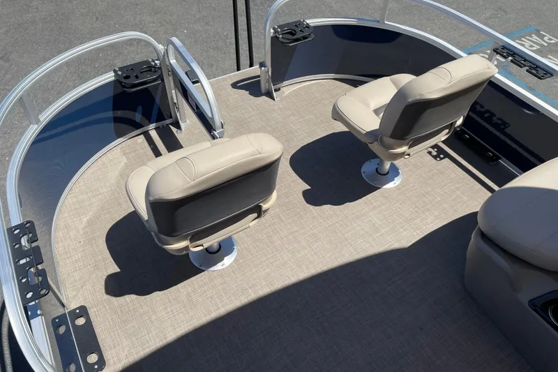Slide: The Image of 2025 Sun Tracker Bass Buggy 16 XL Select boat interior with two beige seats. - 6
