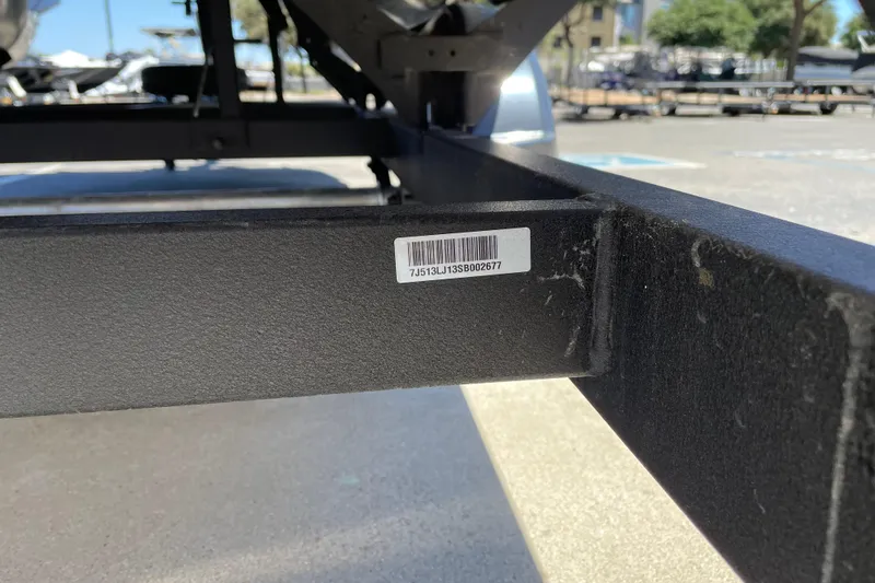 Slide: The Image of 2025 Sun Tracker Bass Buggy 16 XL Select trailer with visible serial number sticker. - 78