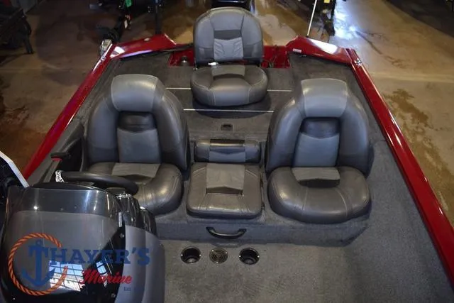 Slide: The Image of 2021 Tracker Pro Team 175 boat interior with gray seating and red accents. - 11