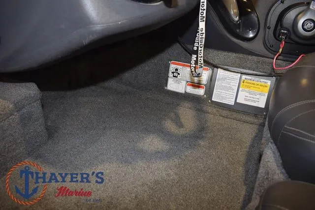 Slide: The Image of 2021 Tracker Pro Team 175 boat interior with safety labels and Thayer's Marine logo. - 15