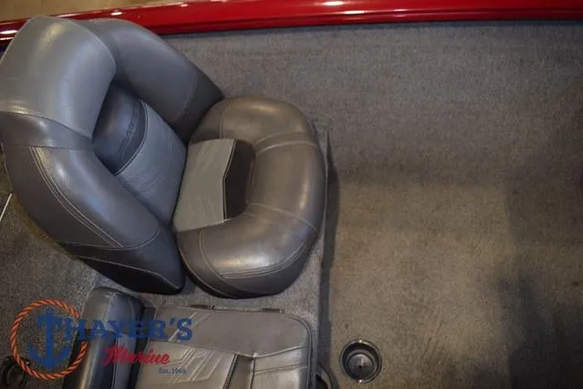 Slide: The Image of 2021 Tracker Pro Team 175 boat interior with gray seating and carpeted flooring. - 17