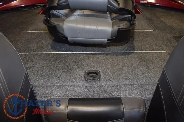 Slide: The Image of 2021 Tracker Pro Team 175 boat interior with gray seating and carpeted flooring. - 23