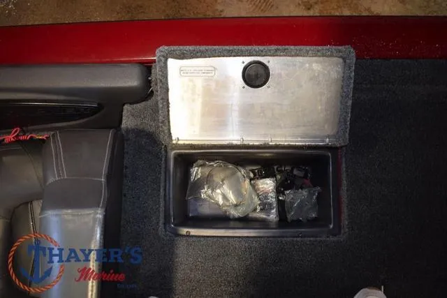Slide: The Image of 2021 Tracker Pro Team 175 storage compartment with accessories, featuring Thayer's Marine logo. - 25