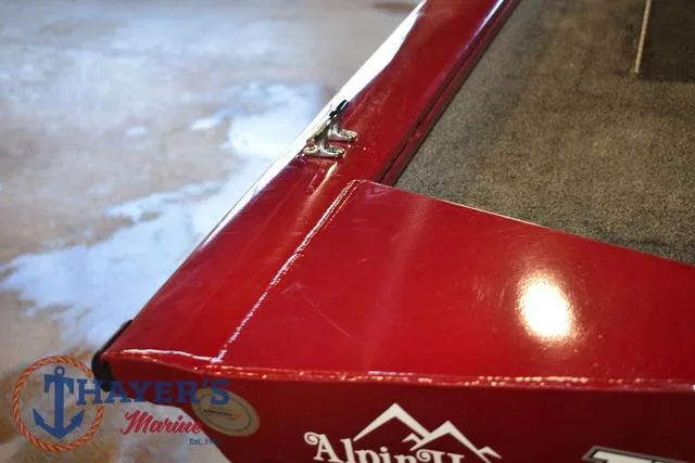 Slide: The Image of 2021 Tracker Pro Team 175 boat, red exterior, Thayer's Marine logo visible. - 33