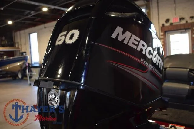 Slide: The Image of 2021 Tracker Pro Team 175 with Mercury 60 horsepower engine in showroom. - 34