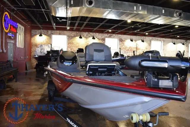 Slide: The Image of 2021 Tracker Pro Team 175 boat displayed indoors at Thayer's Marine showroom. - 6