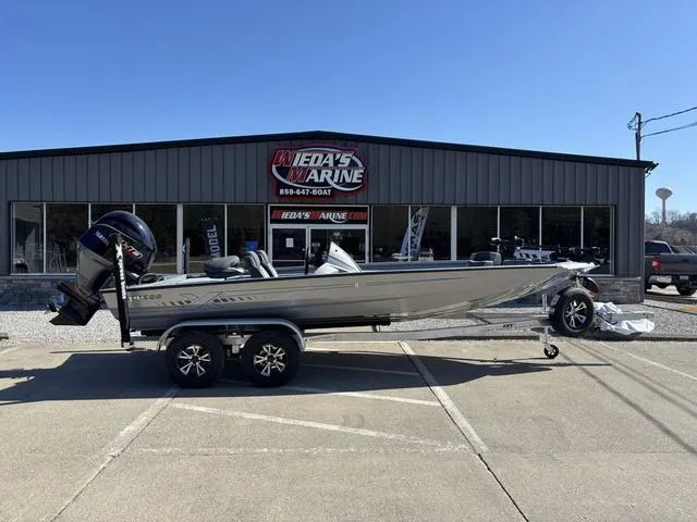 Slide: The Image of 2025 Xpress H20 boat parked outside Ieda's Marine dealership. - 1