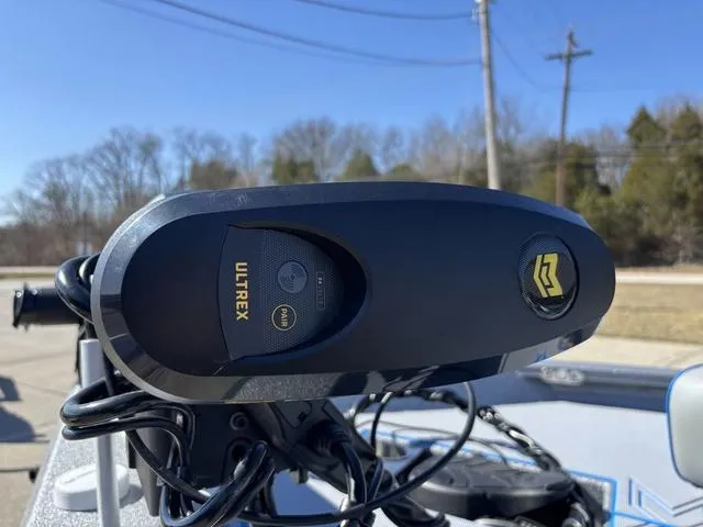 Slide: The Image of Close-up of Ultrex motor on 2025 Xpress H20 boat, outdoors. - 10