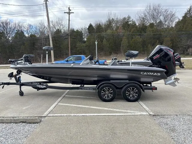 Slide: The Image of 2025 Caymas CX 20 PRO boat on trailer, parked outdoors, side view. - 18