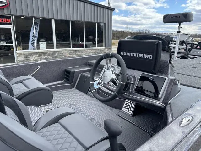 Slide: The Image of 2025 Caymas CX 20 PRO boat interior with steering wheel and Humminbird electronics. - 6