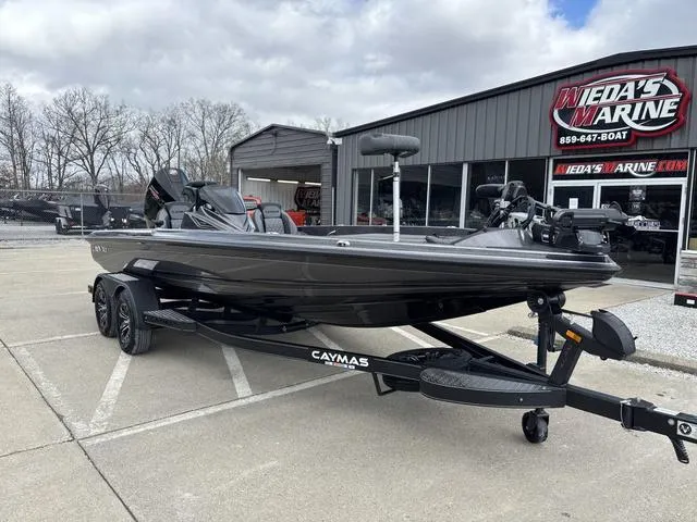 Slide: The Image of 2025 Caymas CX 20 PRO boat on trailer at dealership, cloudy sky background. - 9