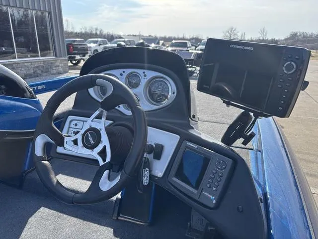 Slide: The Image of 2008 Skeeter ZX200 boat dashboard with steering wheel and electronic display. - 8