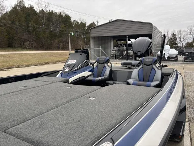 Slide: The Image of 2021 Skeeter FXR21 Limited boat with dual seats and spacious deck. - 11