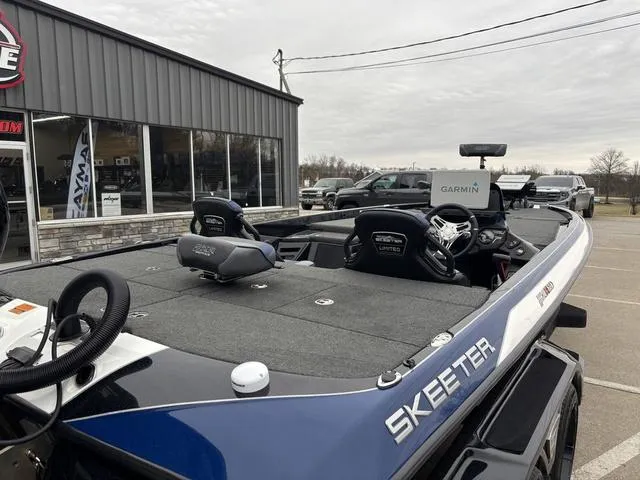 Slide: The Image of 2021 Skeeter FXR21 Limited boat with Garmin equipment, parked outside a showroom. - 4