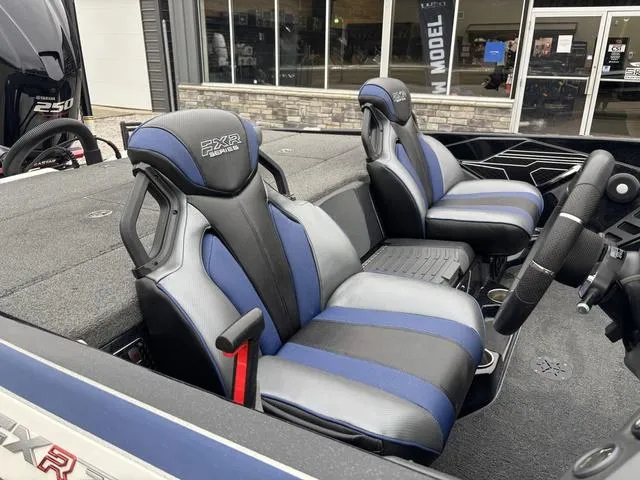 Slide: The Image of 2021 Skeeter FXR21 Limited boat interior with blue and black seats. - 7