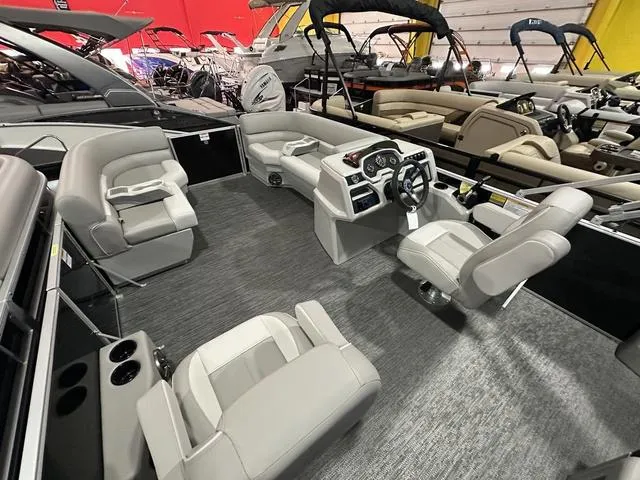 Slide: The Image of 2025 Godfrey Pontoons Xperience 2286 SFLX interior with modern seating and steering console. - 10