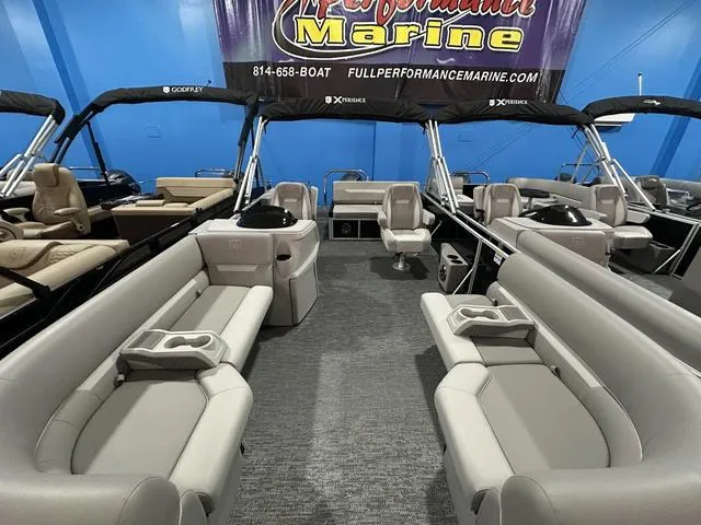 Slide: The Image of 2025 Godfrey Pontoons Xperience 2286 SFLX interior with seating and canopy. - 3